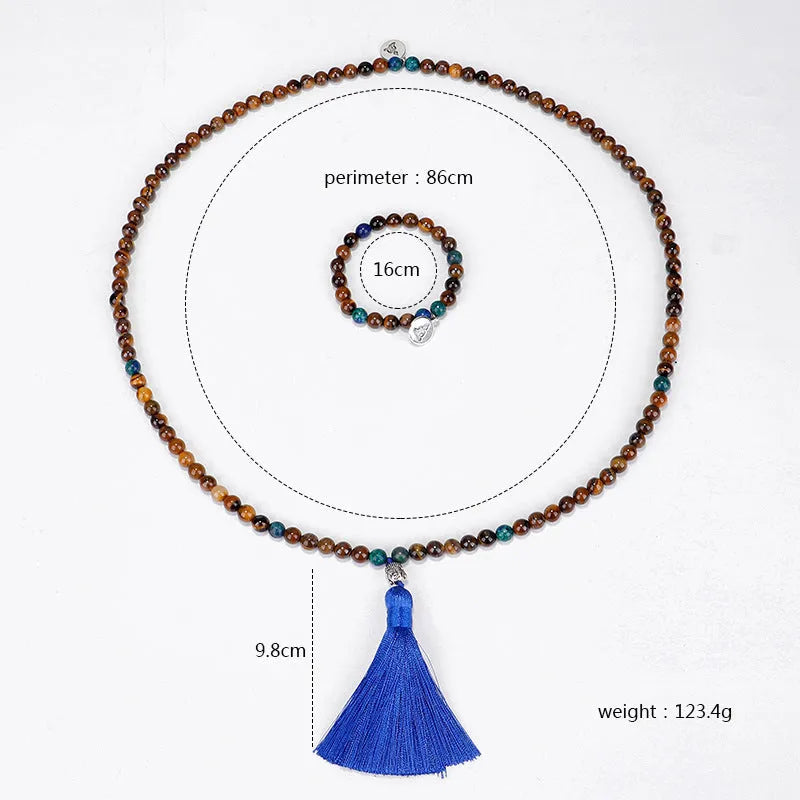 Handmade tiger eye stone bead necklace with Buddha head design, tassel pendant, geometric shape, and 81cm length.