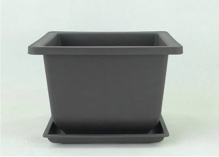 Dark brown antique-style recycled plastic plant pot, shown in a selection of sizes for desktop or floor use.