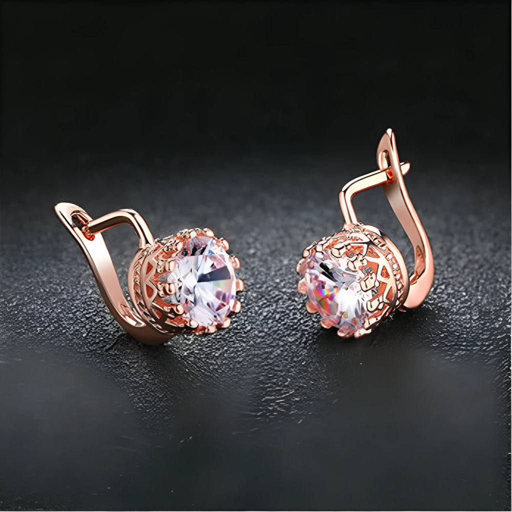 A pair of Korean retro crown-shaped clip-on earrings with a white diamond centre, in a rose gold finish.