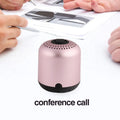 Hieha XQ11 cylindrical metal waterproof Bluetooth speaker in silver colour on a table