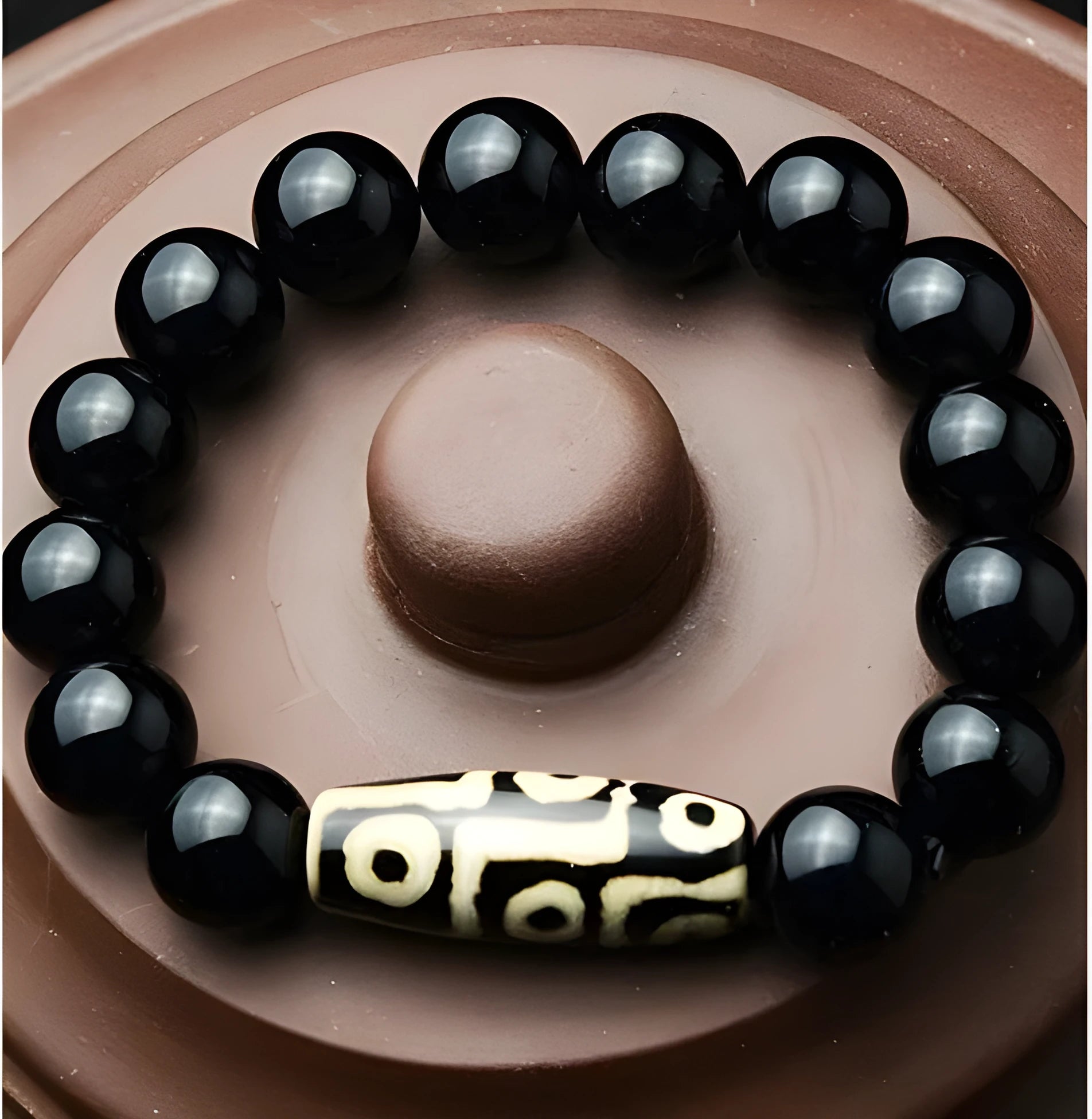Natural black agate bracelet with nine eyes beads on neutral background, three size options 10mm 12mm 14mm