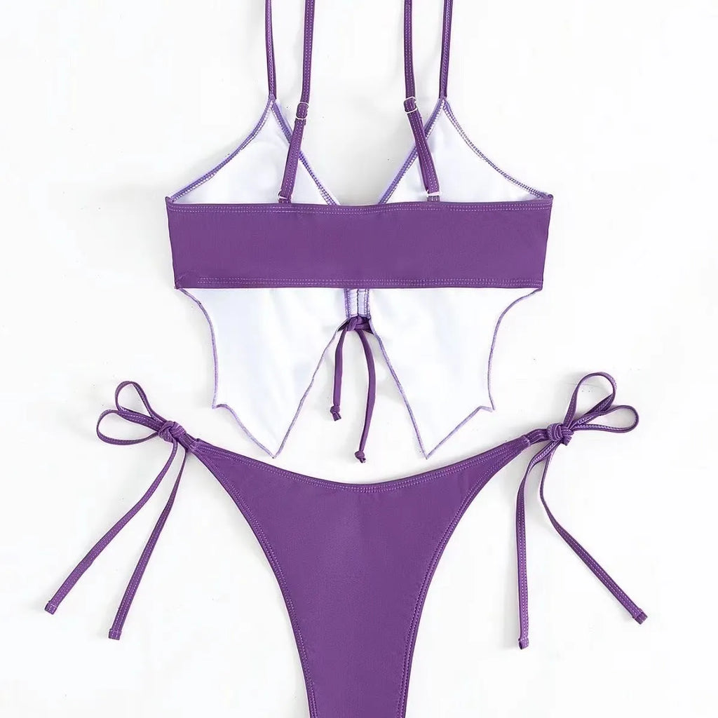 Women's purple bikini swimsuit with bow detail on top and split leg briefs.
