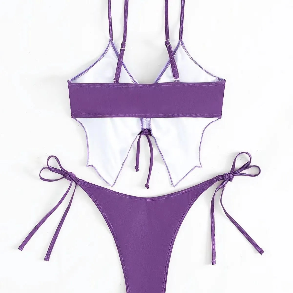 Women's purple bikini swimsuit with bow detail on top and split leg briefs.