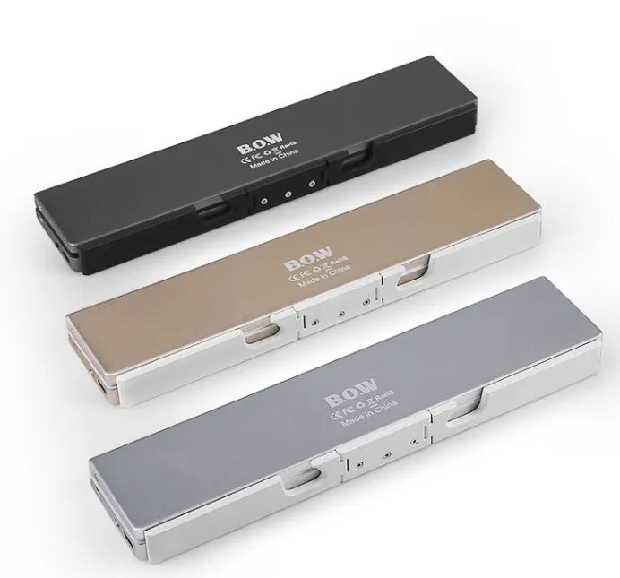 Mini folding Bluetooth keyboard with aluminium alloy backboard, hidden stands, and three-device memory, shown open.