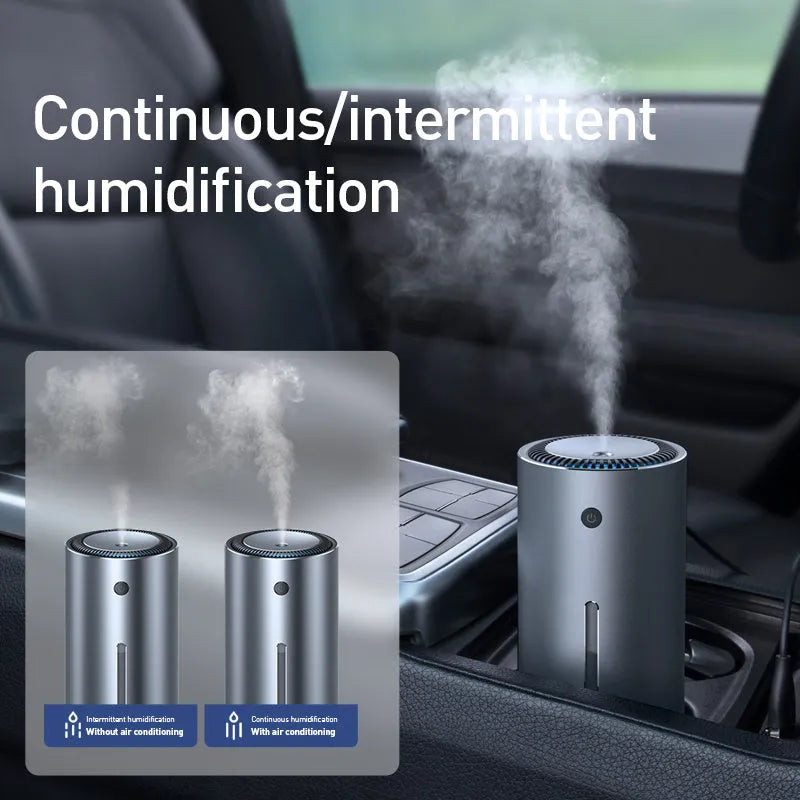 Black aluminium alloy car diffuser humidifier with USB cable, emitting cool mist for vehicle or desktop use.