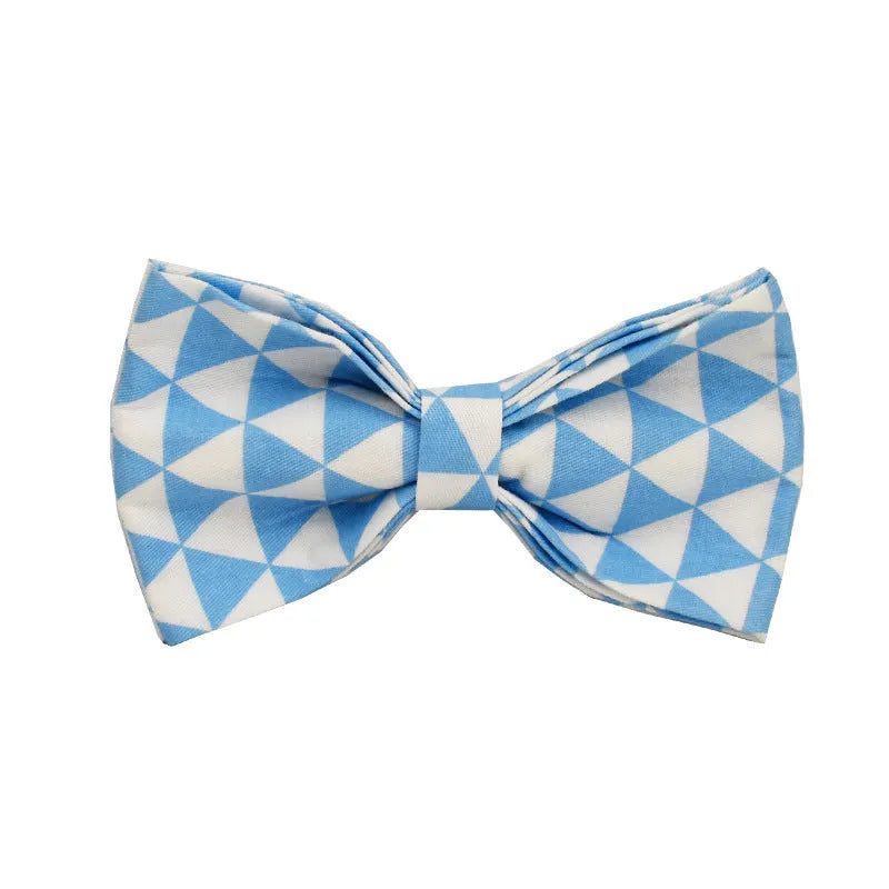 Blue cloth dog collar, lead, bow, and vest set laid out flat showing the four matching pieces.
