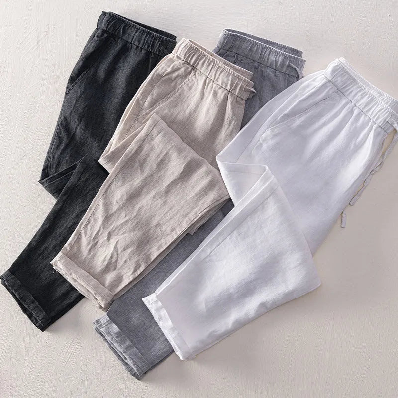 Men's straight-leg linen trousers in a mid waist cut, shown in a neutral colour.