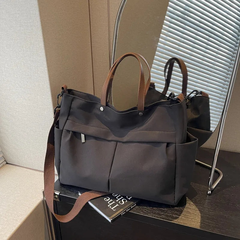 Nylon crossbody tote bag in black colour with shoulder strap