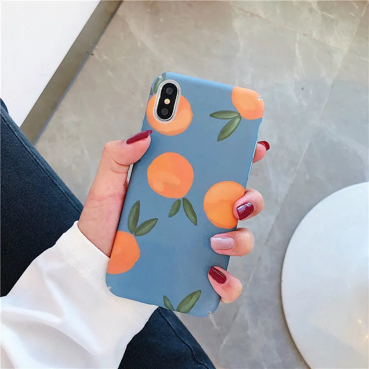 Plastic iPhone case with retro orange fruit and water design on blue background.