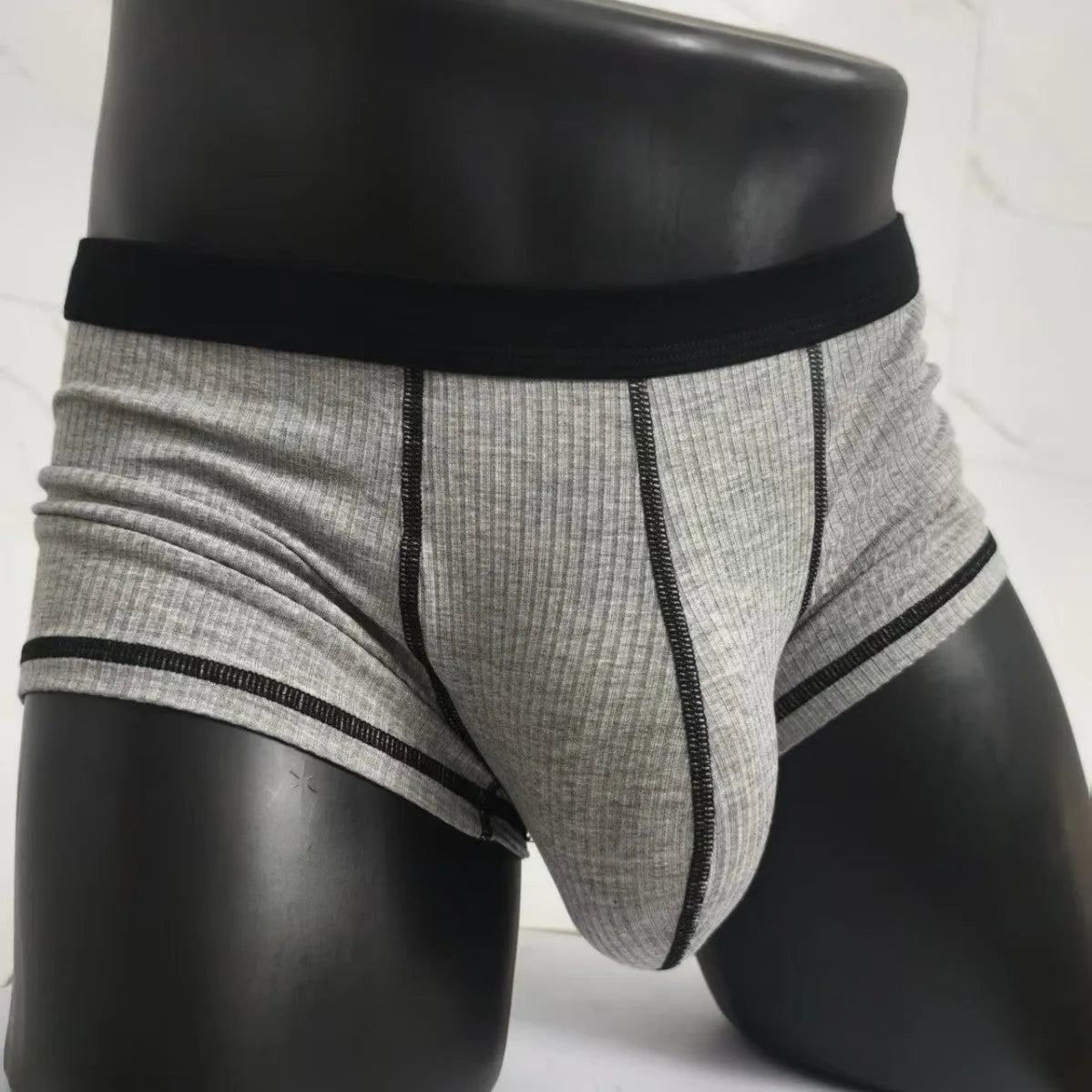 Men's breathable boxer shorts in army green colour showing lightweight fabric and shaping design