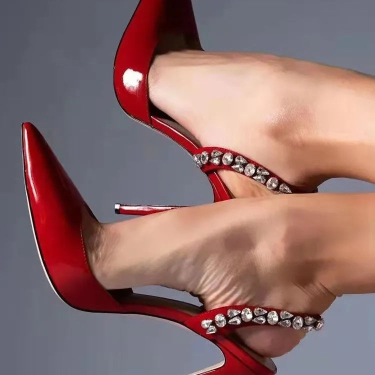 Women's pointed toe high heel sandals with rhinestone decoration on the side, in patent leather.