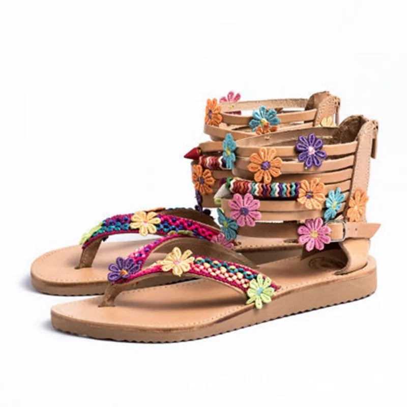 Women's ethnic style beaded petal sandals with floral decoration on a round toe PU upper.