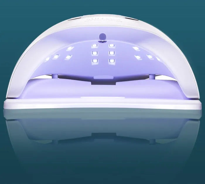 White nail polish dryer lamp with 45 LED/UV beads inside the curing chamber.