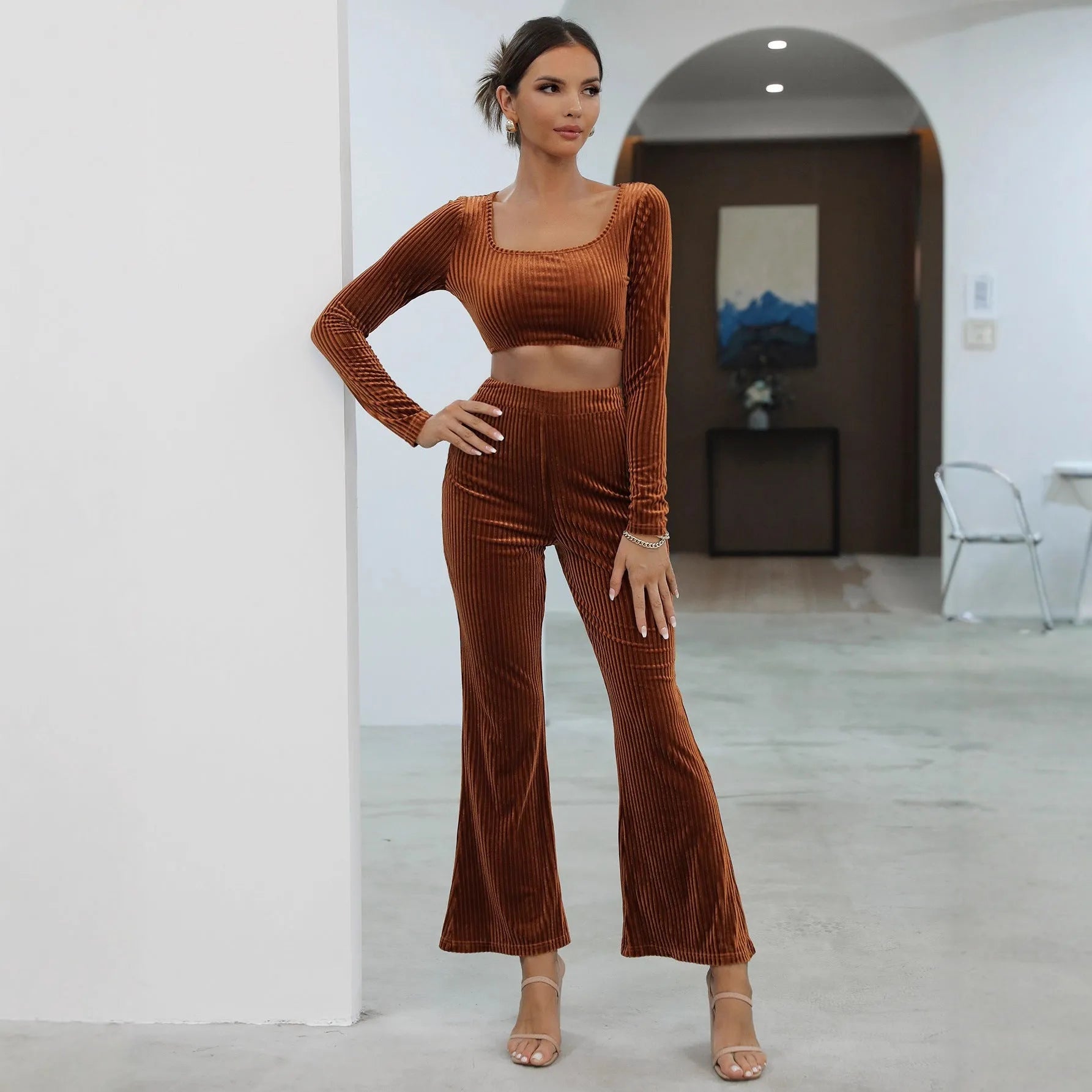 Caramel coloured long sleeve top and matching trousers laid flat, a casual two-piece sweater set.
