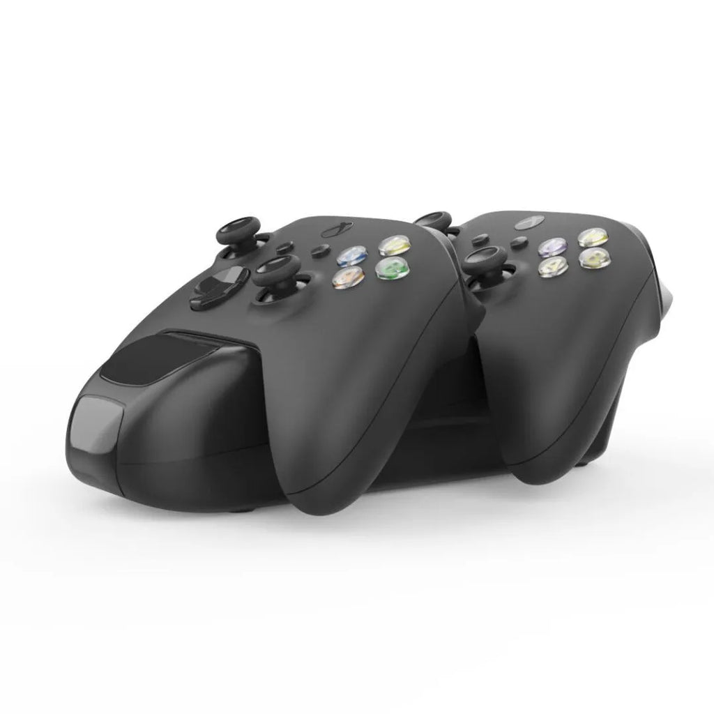 Black Xbox Series X controller charging dock holding two controllers with LED status lights visible.