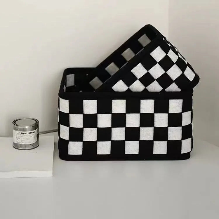 Grey and white checkerboard woven felt storage basket with folded sides, showing dimensions of 37cm by 29cm.