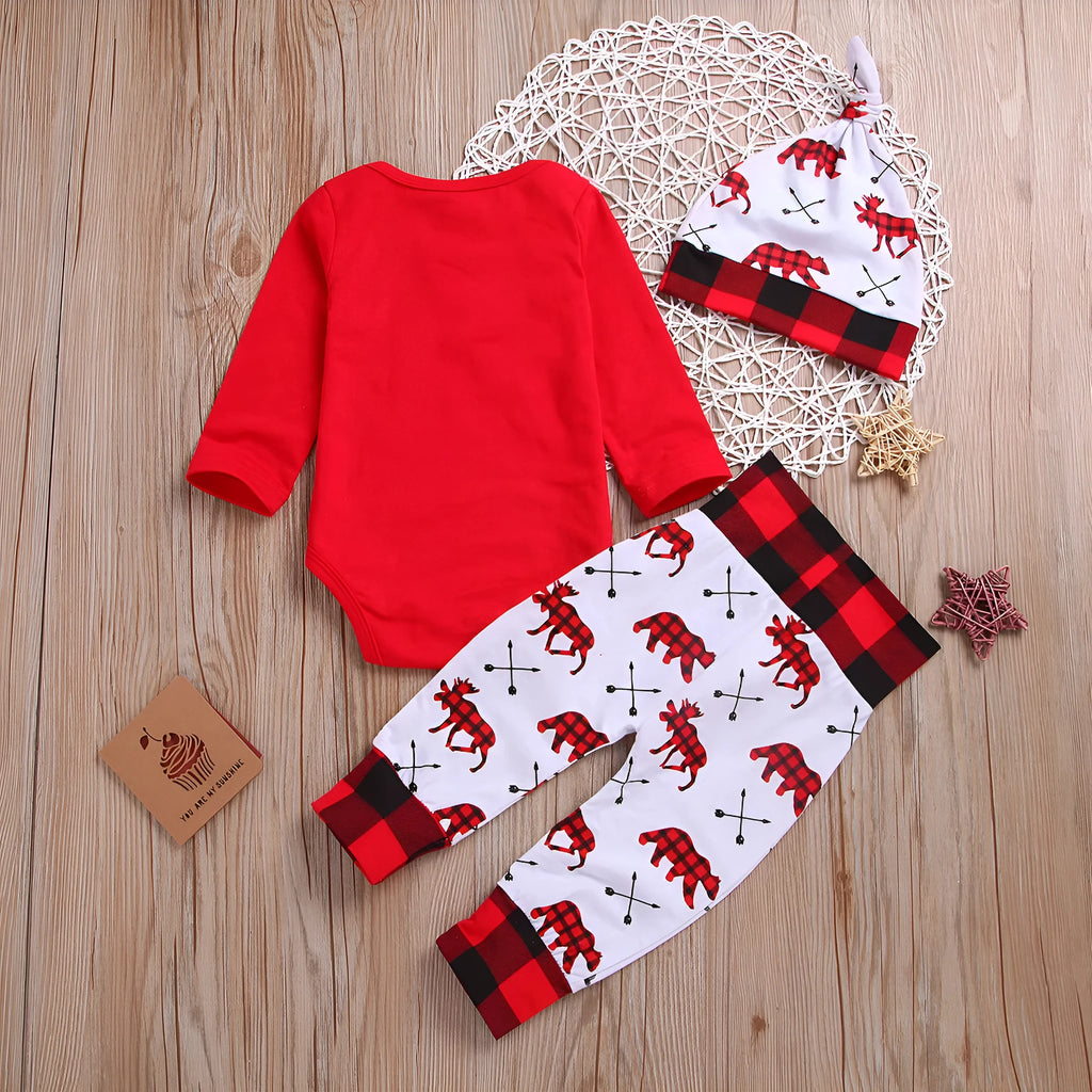 Girls' red Christmas suit with cartoon print top and trousers on white background