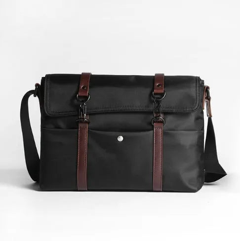 Men's black waterproof tote bag with cross-section square shape, matte finish, and soft handle, designed for 13-inch laptop and business travel