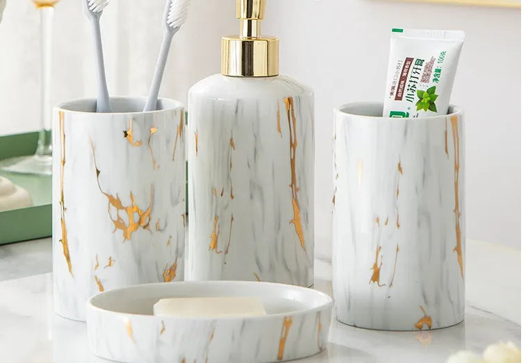 White ceramic bathroom wash set with soap dish, drinking cups, and liquid dispenser in colour gift box