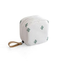 A blue cloth cube-shaped makeup storage bag with a plain pattern, shown closed.