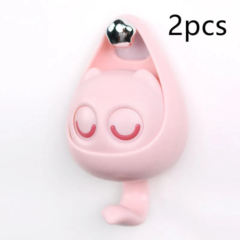 Cream white cat-shaped adhesive wall hook with winking eyes, 2.5kg capacity, 105x61x45mm