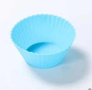 Twelve reusable silicone cupcake liners in six colours, two cups per colour, with a nonstick surface.