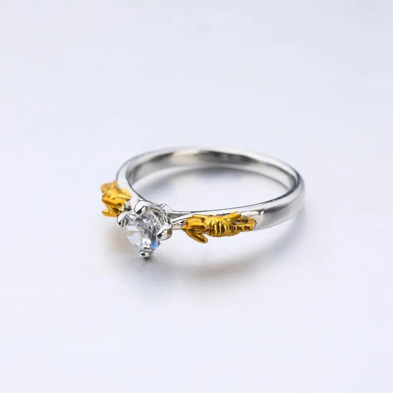 Detailed black gold copper crown ring on a finger, showing crown modelling and metallic finish.