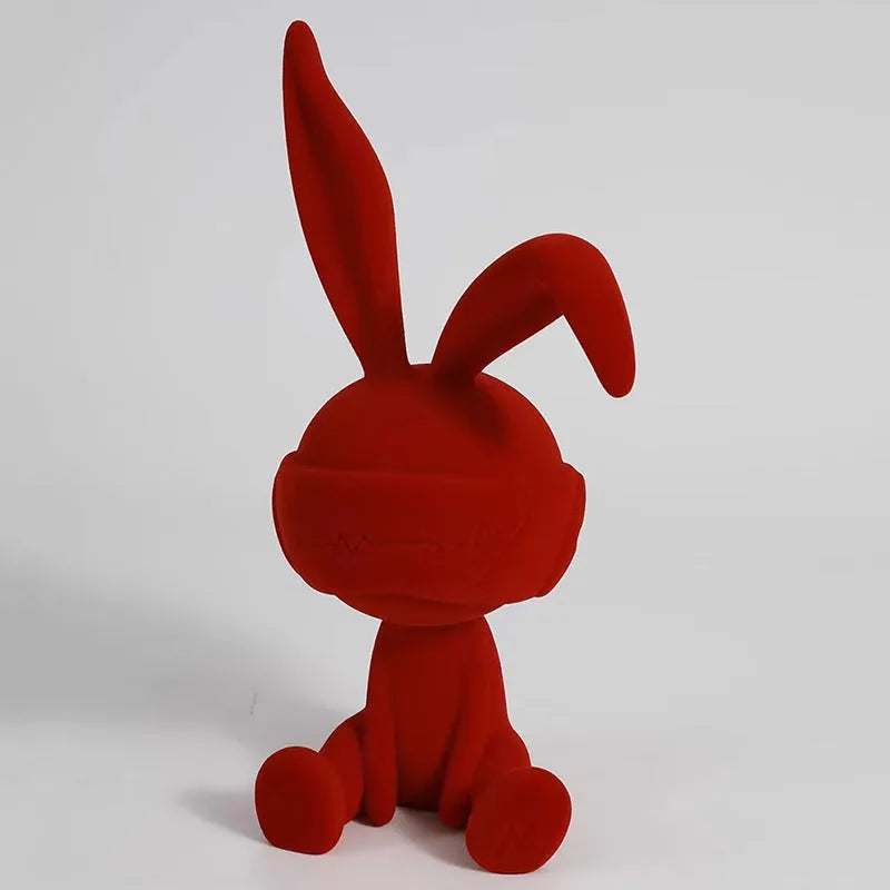 Suede blindfold rabbit resin table ornament in choice of blue, green, or red colours.