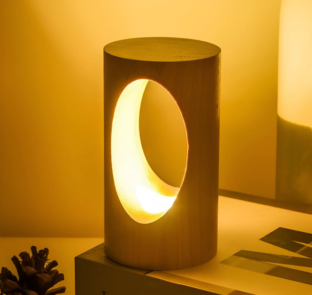 Solid wood LED reading lamp with glass lampshade on a desk, USB cable visible