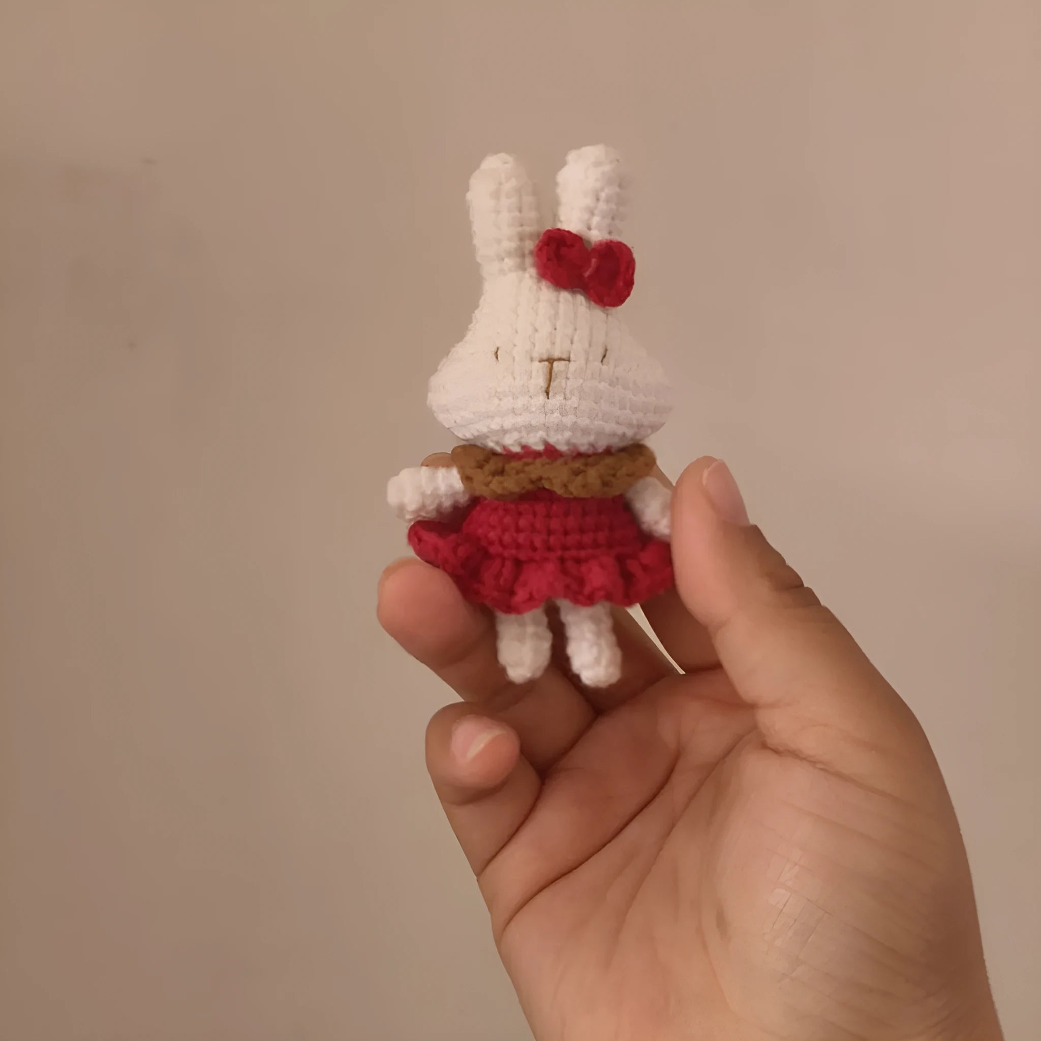 Hand-crocheted wool rabbit key chain with animal pendant design