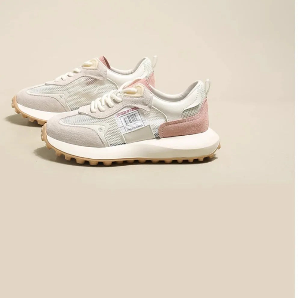Women's grey and pink retro sneaker with low-top design and flat rubber sole