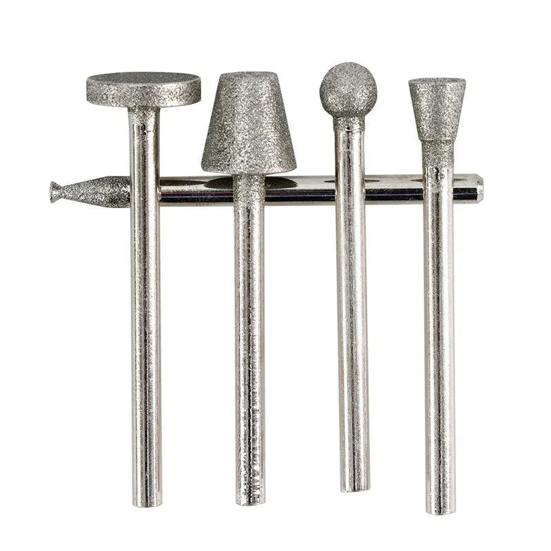 Close-up of an alloy elliptical cone grinding head with emery grit on a 3mm shank.
