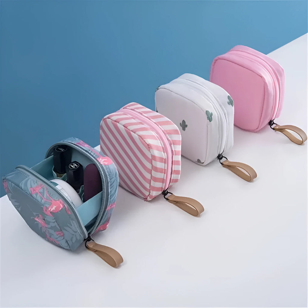 A blue cloth cube-shaped makeup storage bag with a plain pattern, shown closed.
