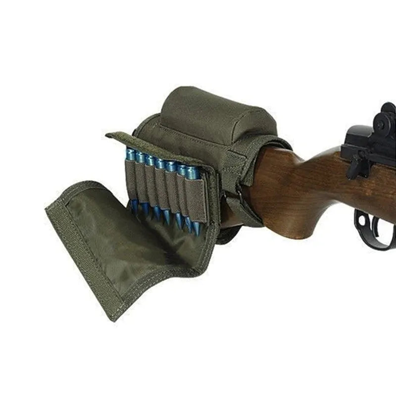 Tactical cheek rest with black nylon surface, hook and loop straps, and removable ammo carrier attached to a rifle stock