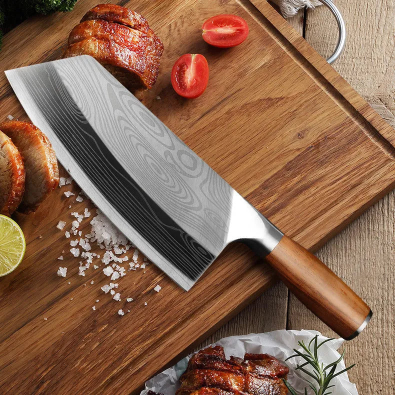 Stainless steel kitchen knife with a 320mm forged blade on a kitchen counter.