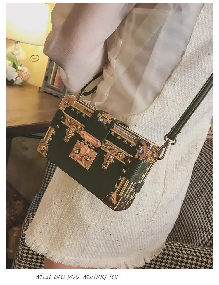 Women's hard-shell PU shoulder and crossbody handbag with hasp closure in black or green.