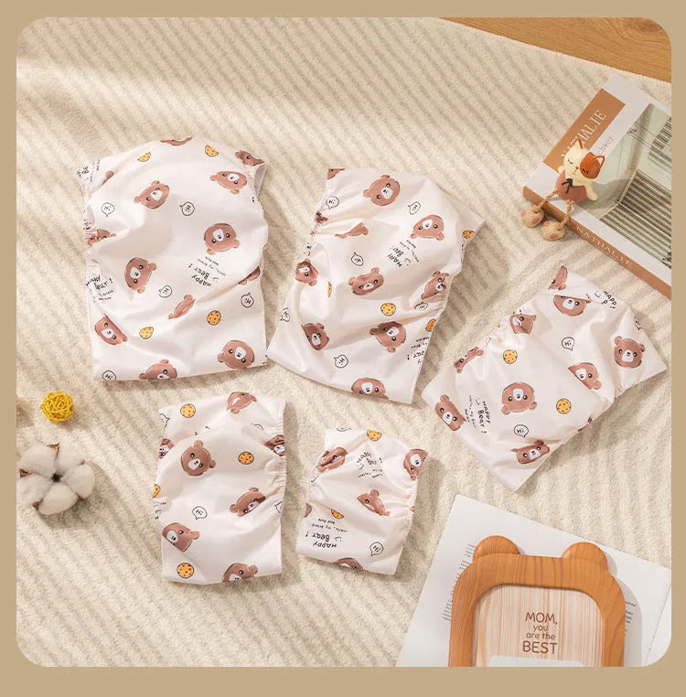 Reusable cartoon bone print dog diaper with fastener tape and elastic waistband, shown in blue bear pattern.