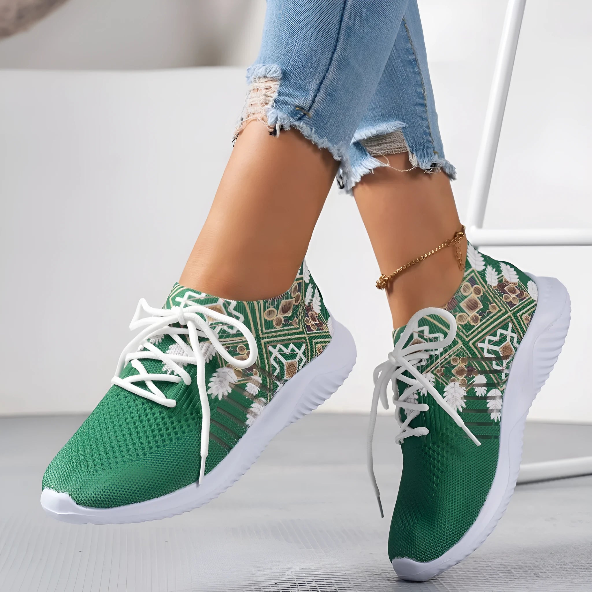 Women's woven flat casual sneakers in green with mesh upper, round toe, front lace-up, and rubber sole
