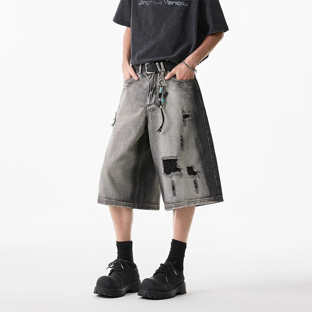 Grey water washed denim shorts with hole detailing and loose retro fit