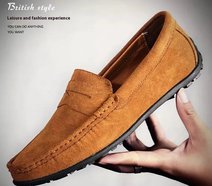 Men's brown suede Gommino casual loafers with a round toe and flat rubber sole.