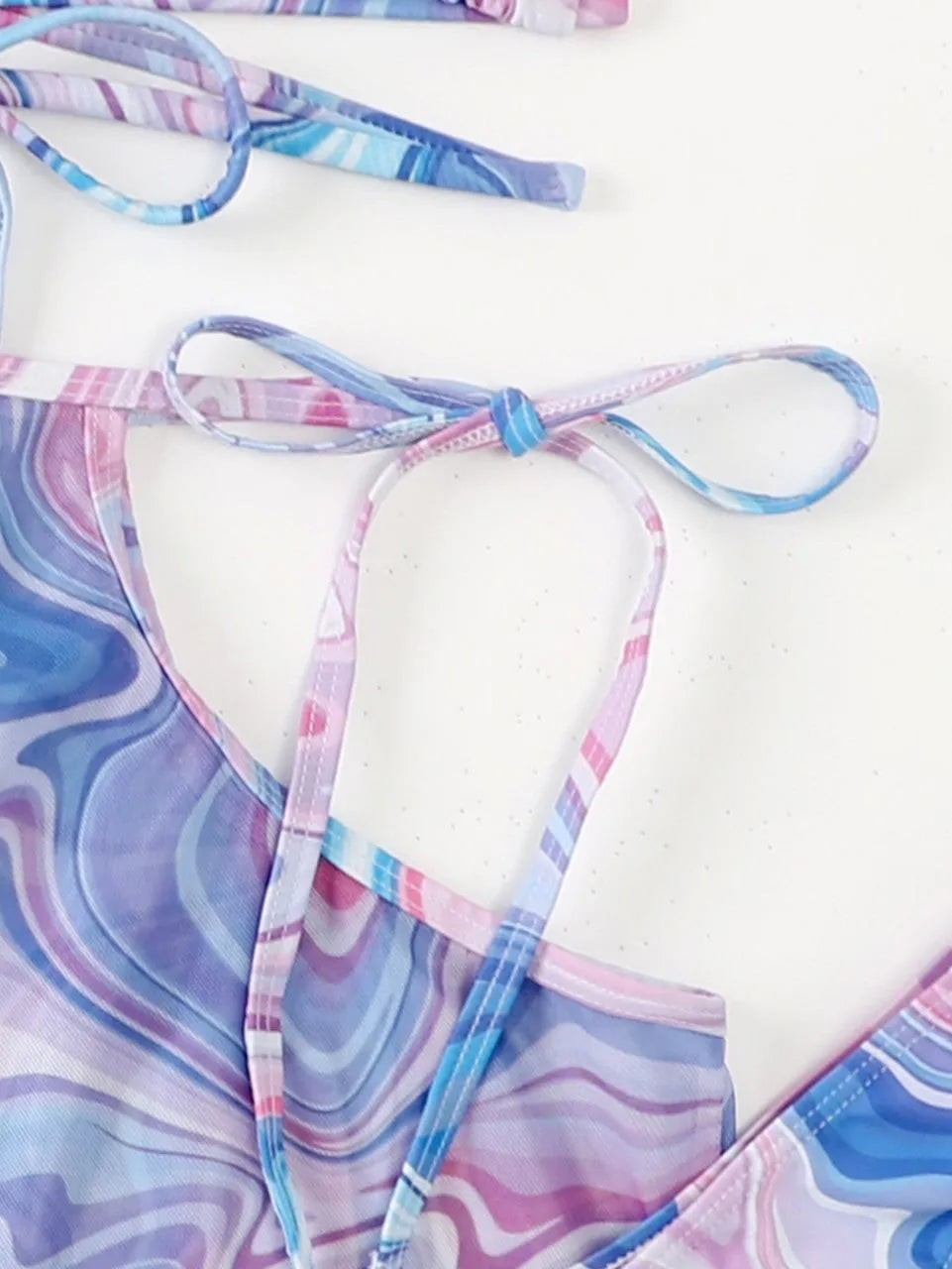 Lavender three-piece bikini set with beach skirt for women, shown in sizes S M L