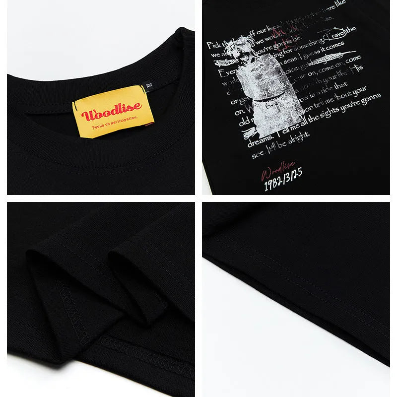 Men's black loose-fit pure cotton T-shirt with white printed letter design and raglan short sleeves.