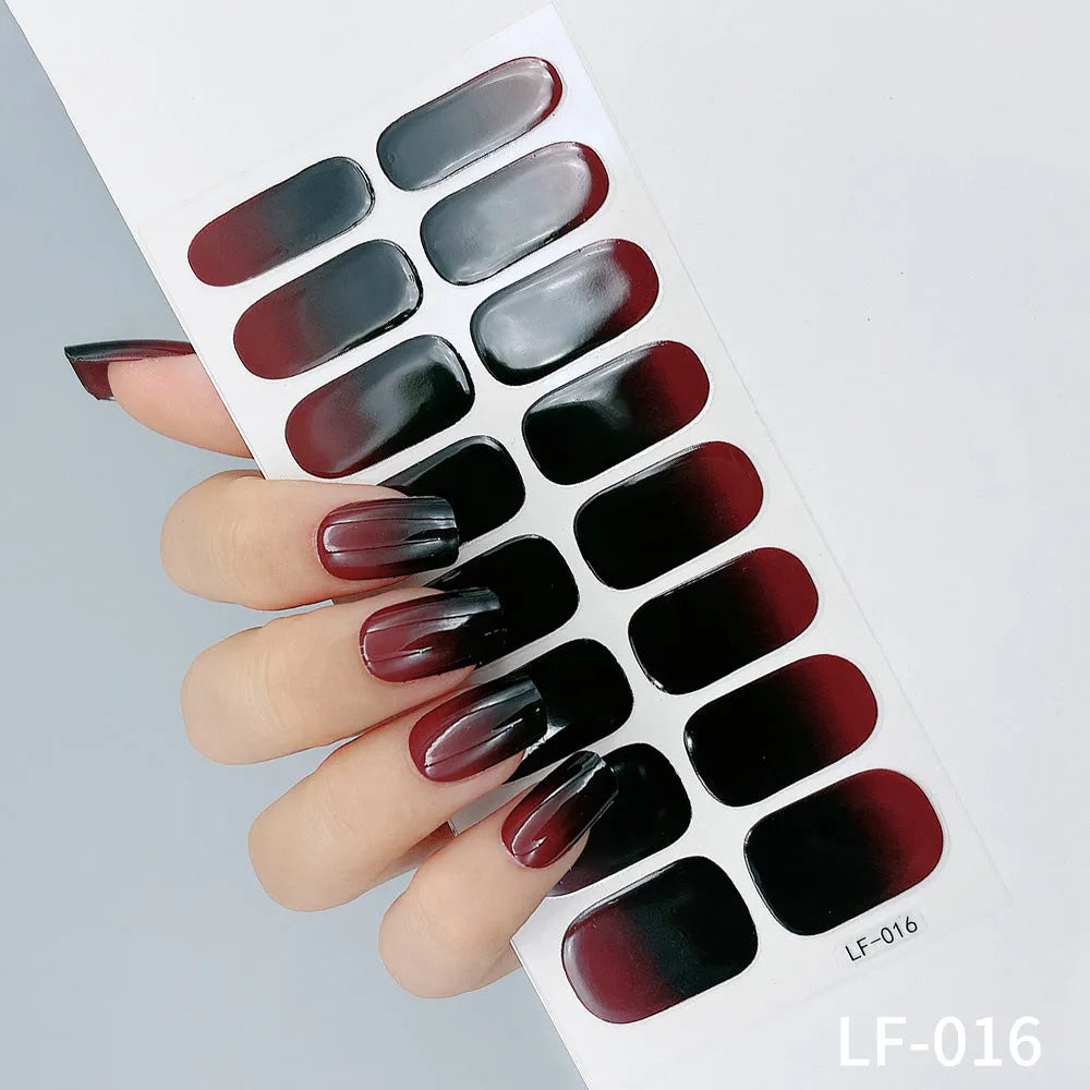 16 solid colour full nail art stickers with 22 patterns including cross, rose, butterfly designs in 12x6mm oval size