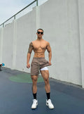 Men's ice silk quick-drying double-layer casual shorts in black, shown with an elastic waistband.