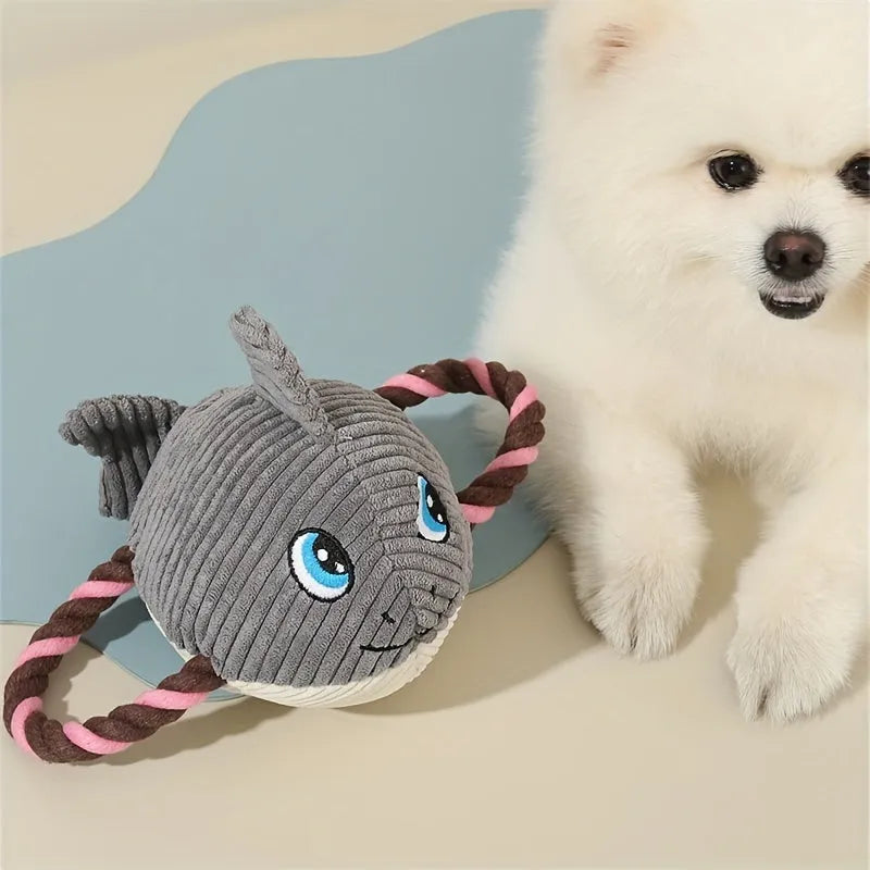Grey turtle-shaped plush dog toy with green knotted rope limbs for chewing