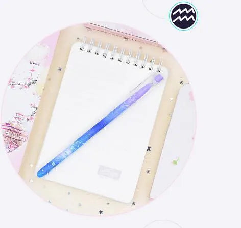 Box of 12 constellation-themed quick-drying gel pens with plastic bodies and coloured caps