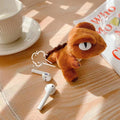 Plush dinosaur doll earphone protective cover for AirPods case in brown colour, soft shockproof storage