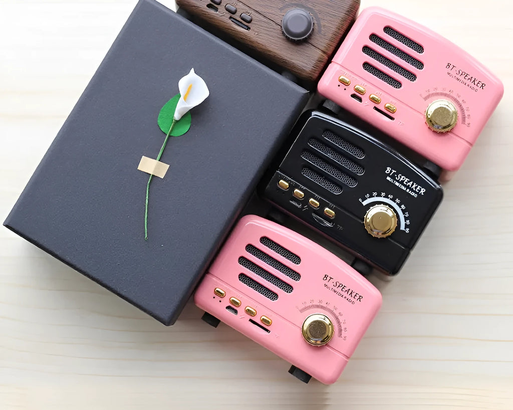Compact vintage wood-grain finish Bluetooth speaker with control buttons on top.