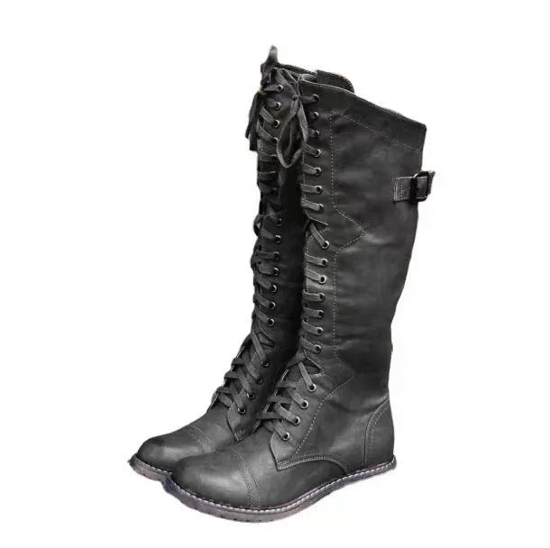 Black women's high leg boots with a low chunky heel and round toe made from artificial PU.