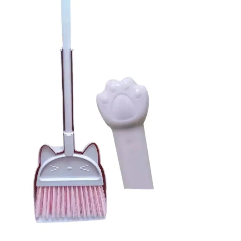 Purple, green, and beige plastic broom and dustpan set with a rotating brush holder.